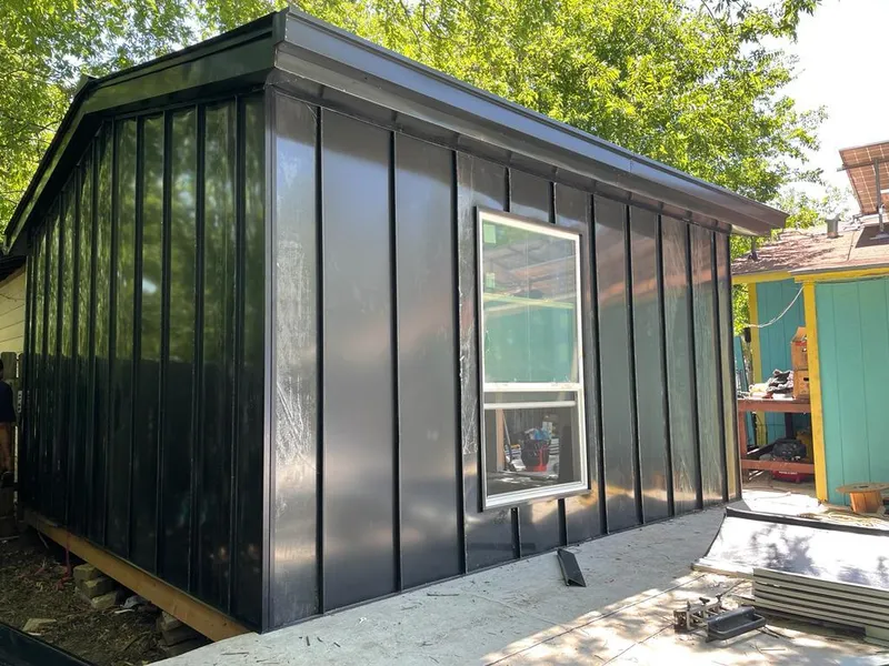 Black standing seam metal wall panels for Roof Inspection in Ripon